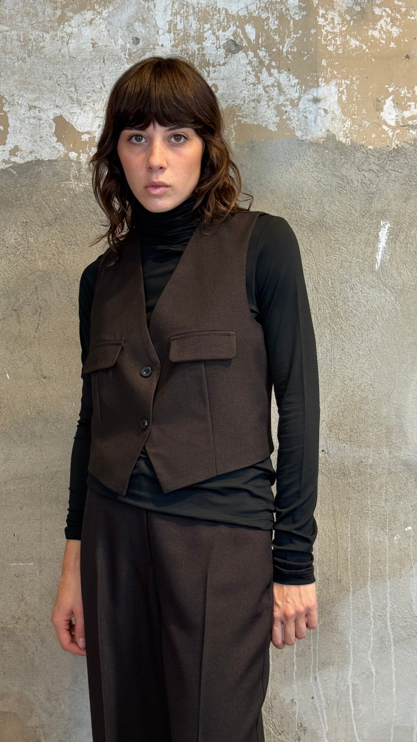 Gilet cinturino e tasche